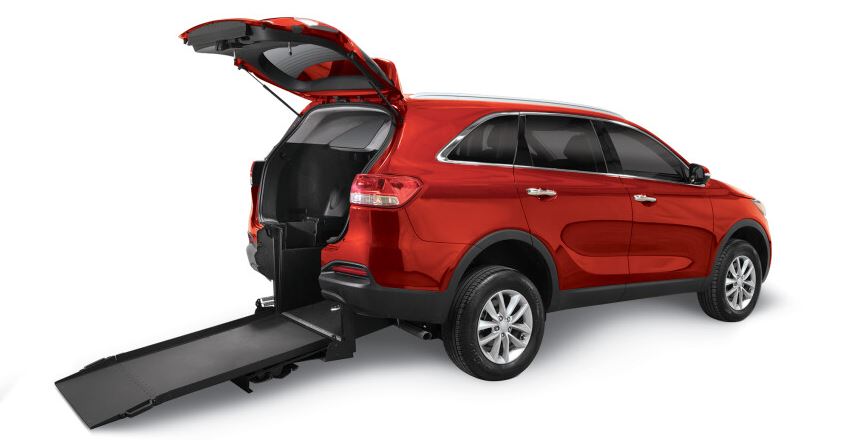 FMI Conversions Kia Sorento with ramp deployed from rear hatch.