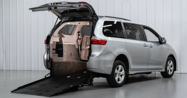 FMI Conversions Toyota Sienna with ramp deployed from rear hatch.